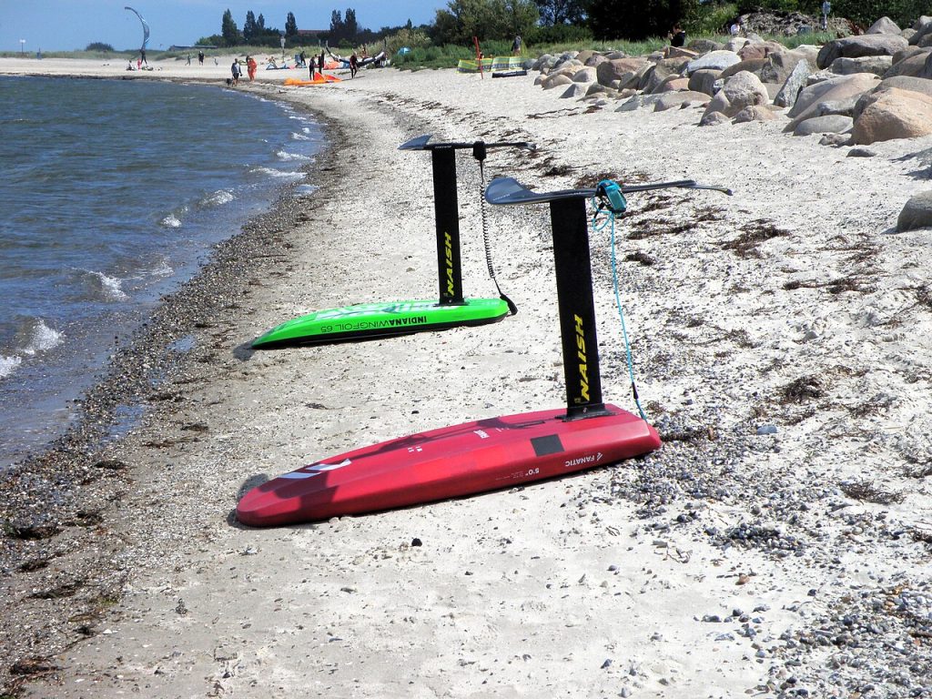 Foil boards with foils lying on the grass